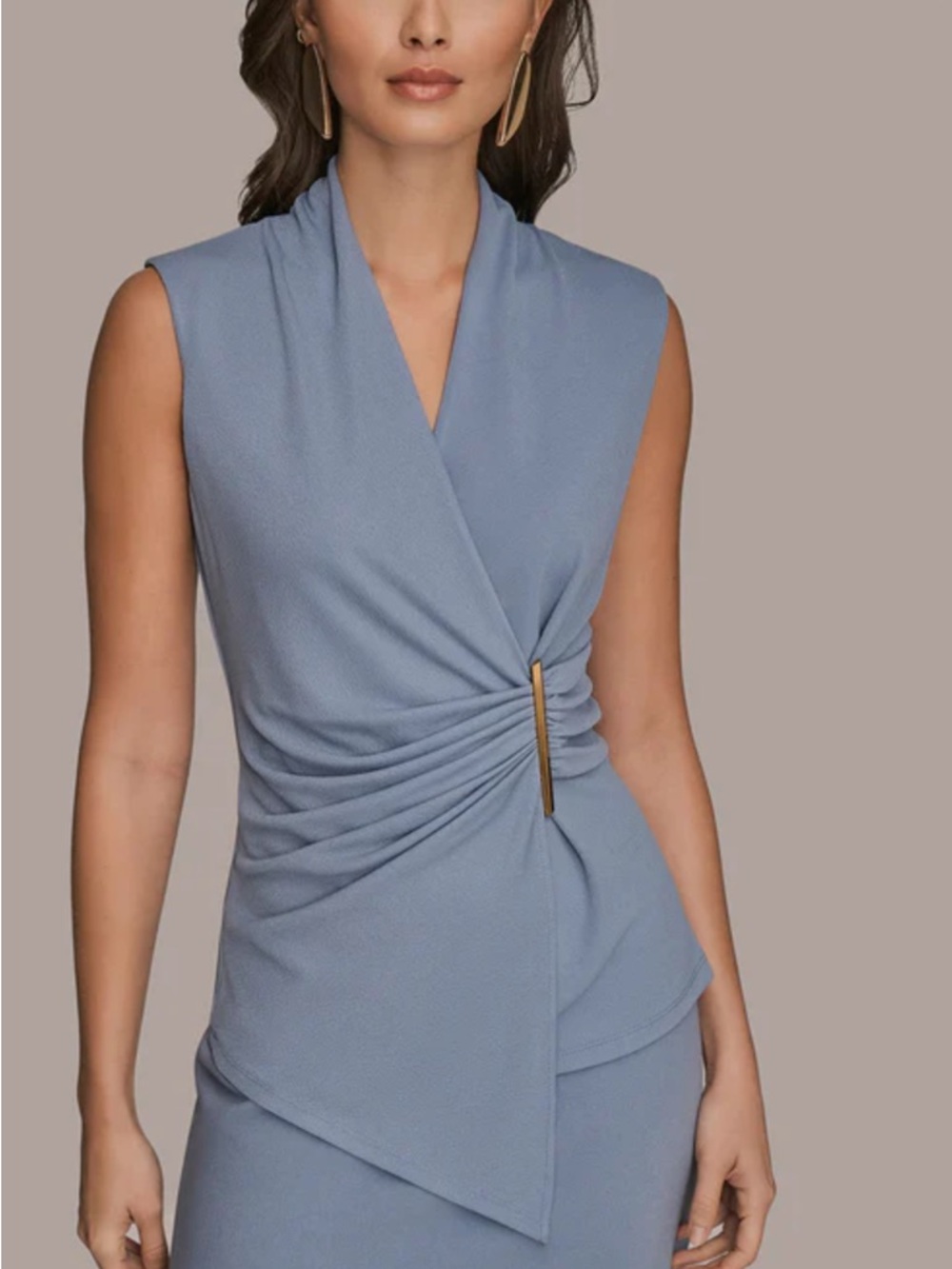 Donna Karan tempest light blue top with faux wrap front, asymmetric front hem.